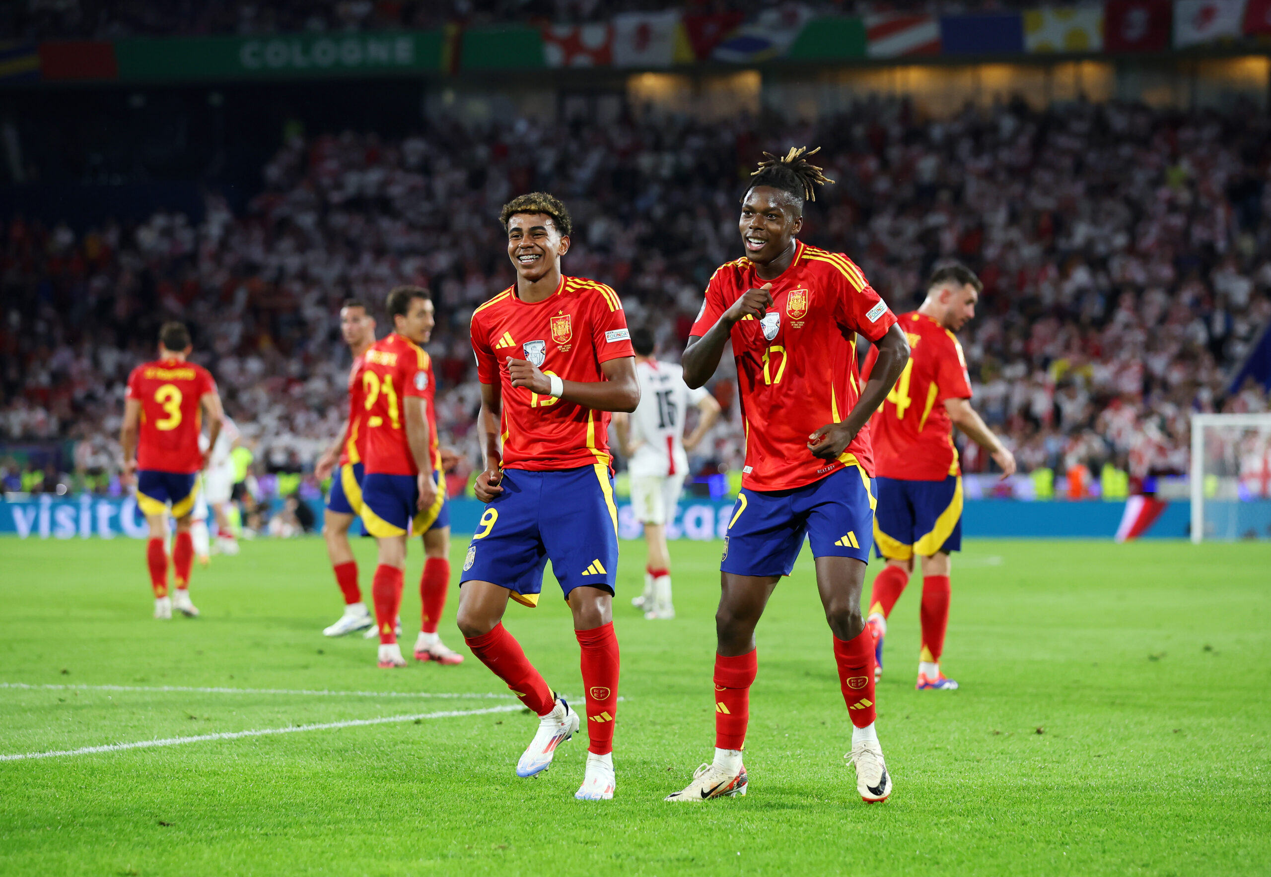 COLOGNE, GERMANY - JUNE 30: Nico Williams of Spain celebrates scoring his team's third goal with teammate Lamine Yamal during the UEFA EURO 2024 round of 16 match between Spain and Georgia at Cologne Stadium on June 30, 2024 in Cologne, Germany.
